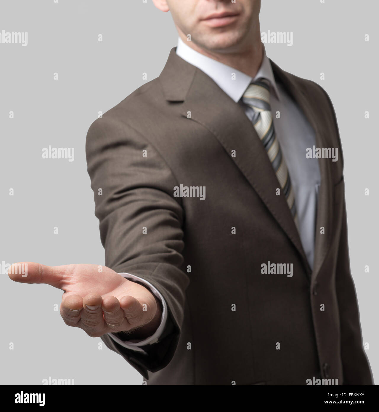 Businessman with outstretched hand Stock Photo