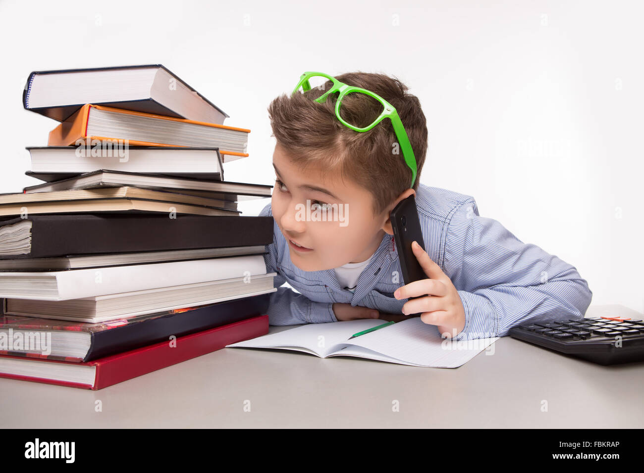 Little business boy talking over mobile phone Stock Photo