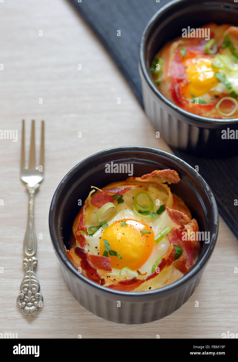 Menu breakfast cups eggs with bacon Stock Photo Alamy