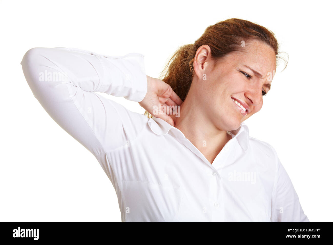Young woman with pain massaging her neck Stock Photo - Alamy