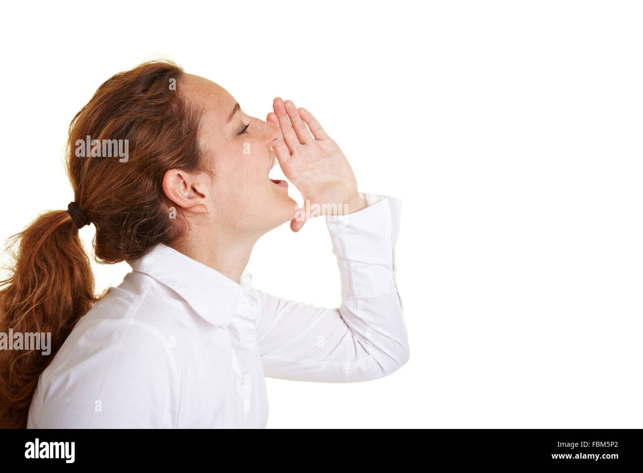 Business woman screaming loudly with hand on her mouth Stock Photo