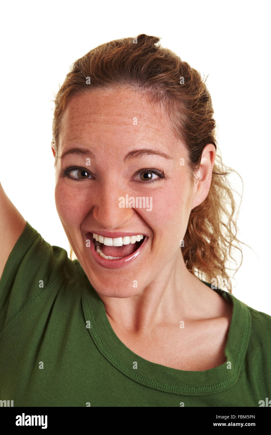 Cheering happy young woman looking into the camera Stock Photo Alamy