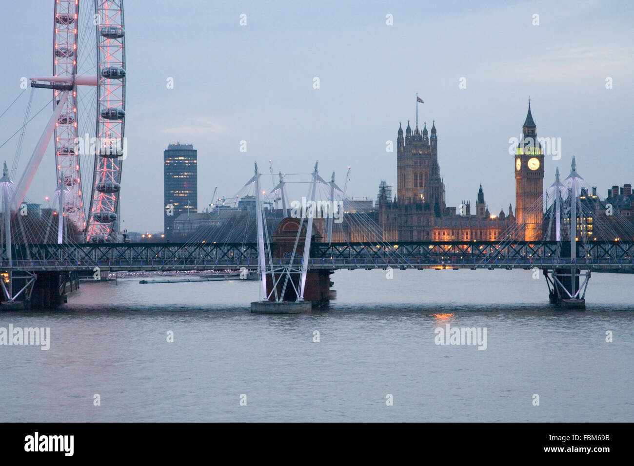 Big Ben Houses of Parliament and London Eye view from Waterloo Bridge at night Stock Photo