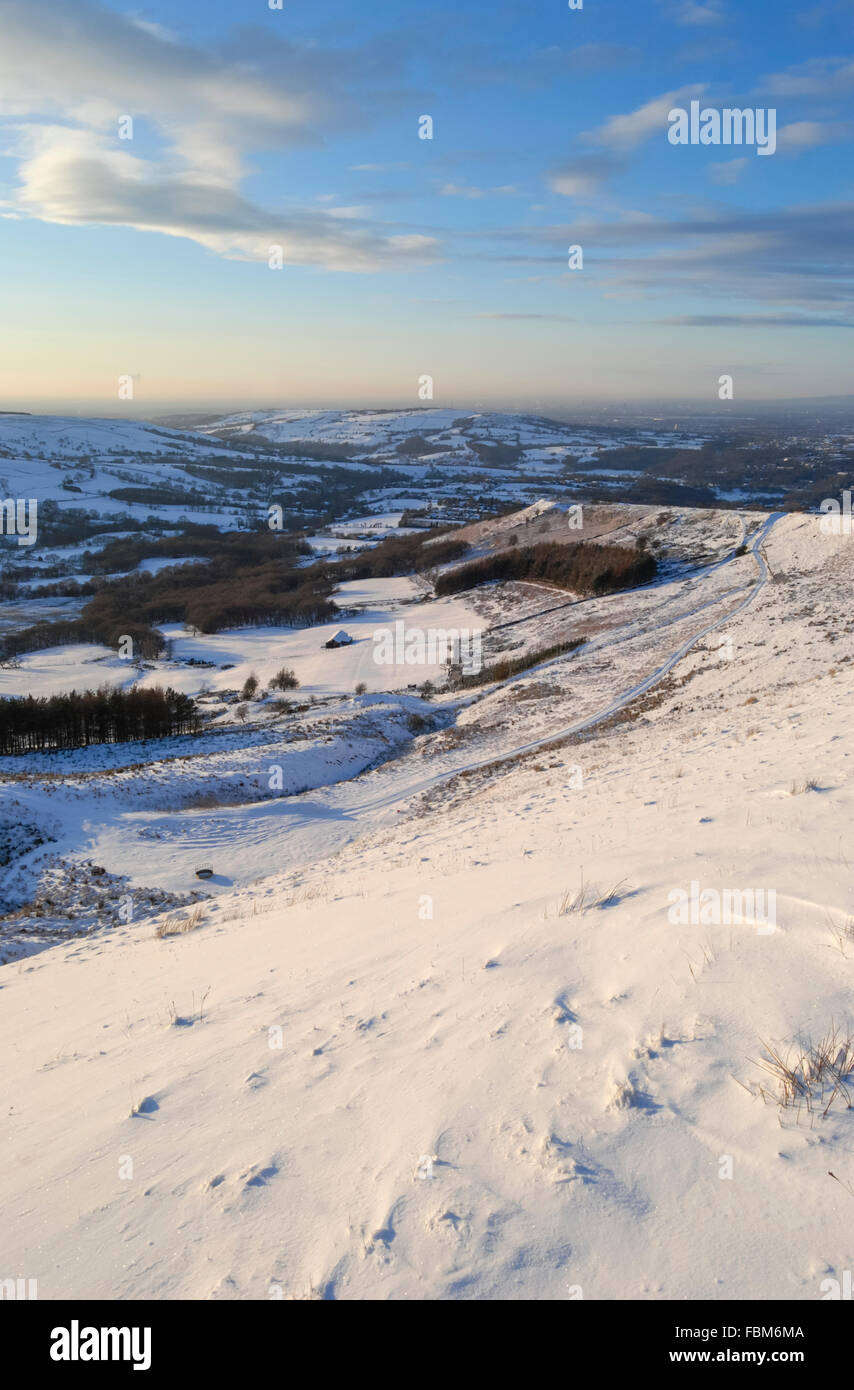 Snowy English landscape above the village of Charleworth near Glossop in Derbyshire. View towards Manchester. Stock Photo