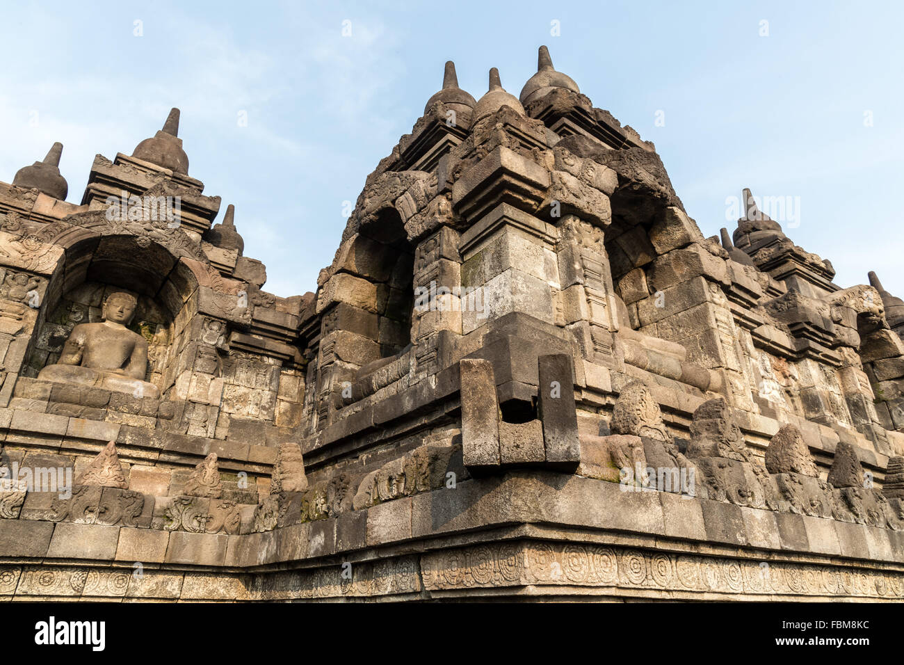 Stone Buddha sculpture. Borobudur. Indonesia. Borobudur is the largest Buddhist temple in the world. Stock Photo