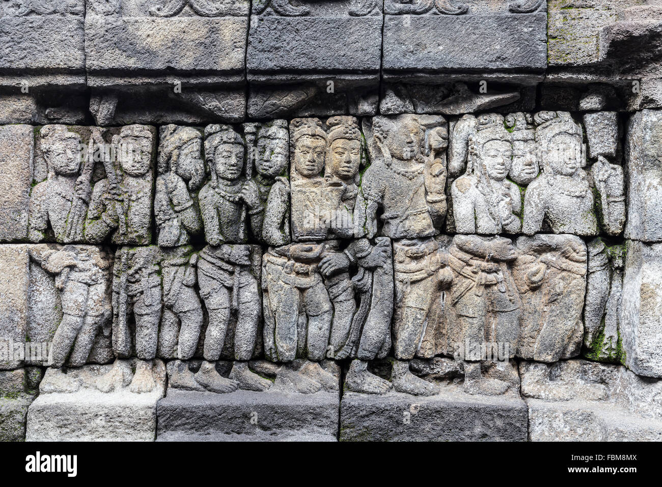 Relief panels of Borobudur temple in Indonesia. Borobudur is the largest Buddhist temple in the world. Stock Photo