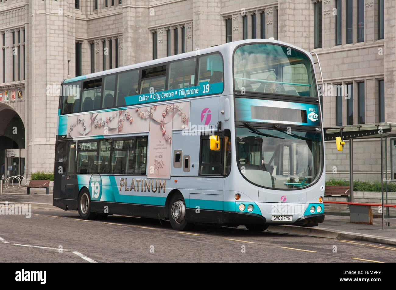 Bus in Aberdeen city centre, outside Marischal College - Scotland, UK. Stock Photo