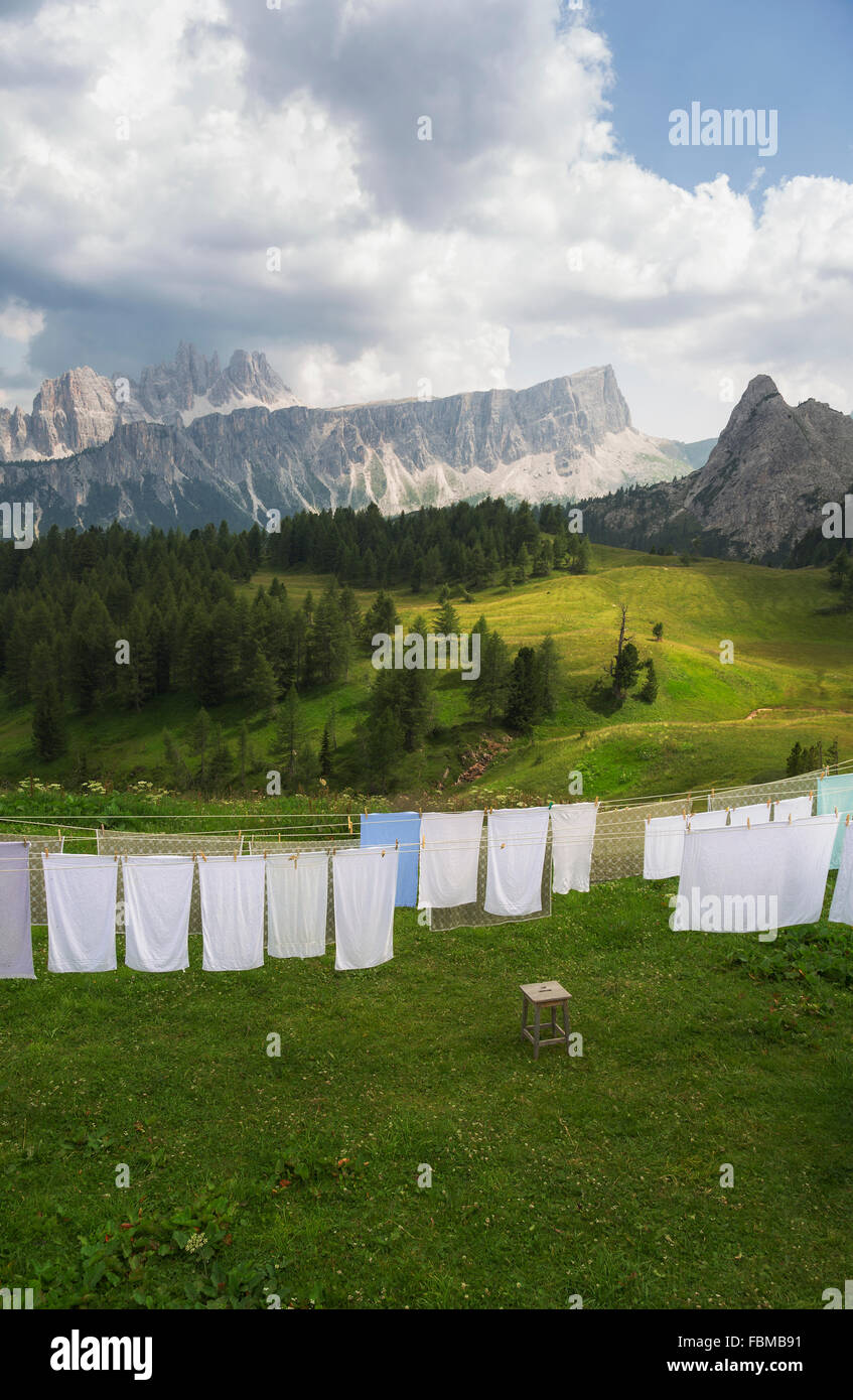 Alpine meadow sheets and towels washing hanging on a washing line, Dolomites, Italy Stock Photo