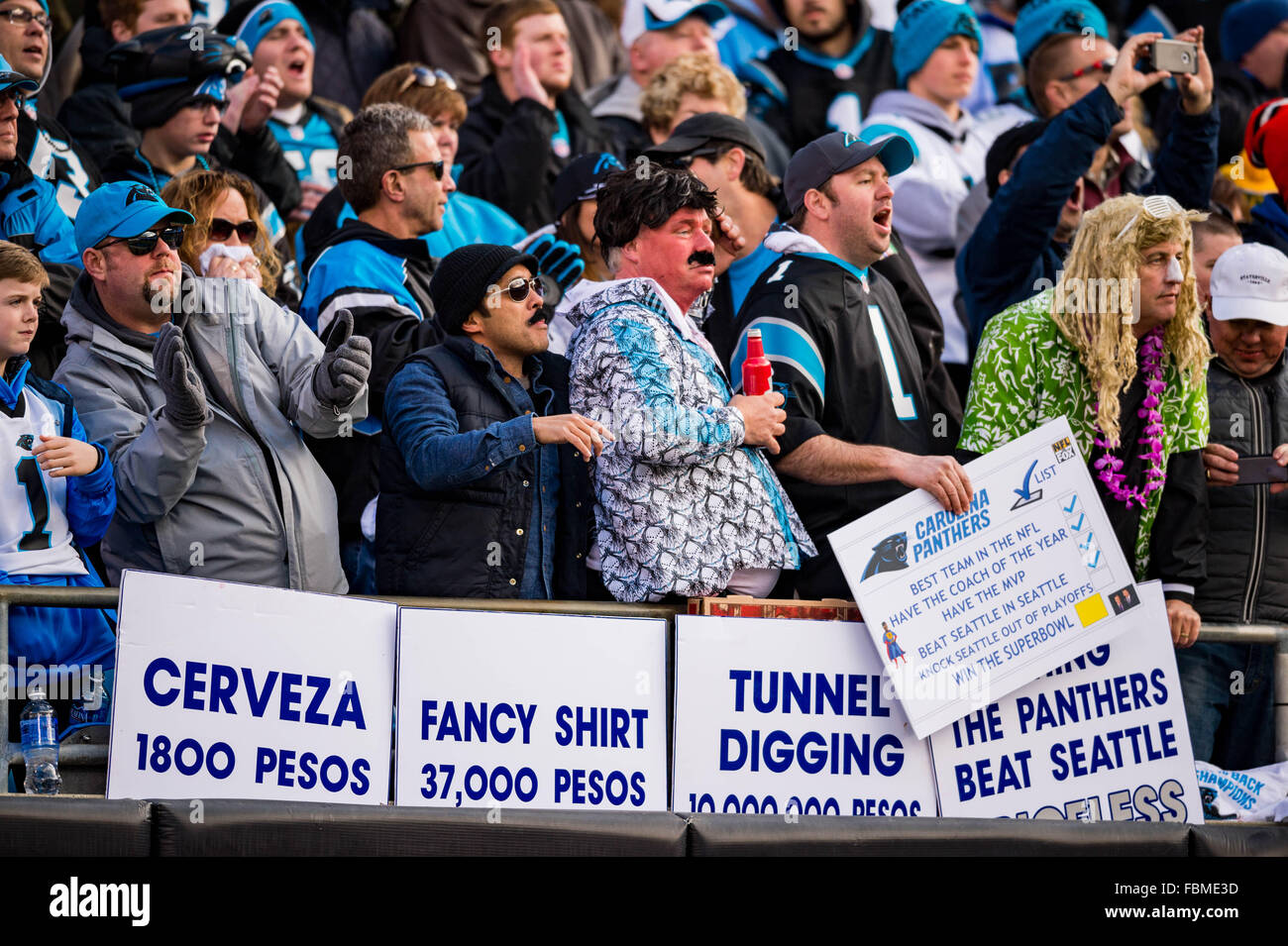 Charlotte, North Carolina, USA. 17th January, 2016. Fans hold up signs that reference El Chapo during the NFL Football Divisional Playoff game between the Seattle Seahawks and the Carolina Panthers on Sunday, Jan. 17, 2016 in Charlotte, NC. Credit:  Cal Sport Media/Alamy Live News Stock Photo