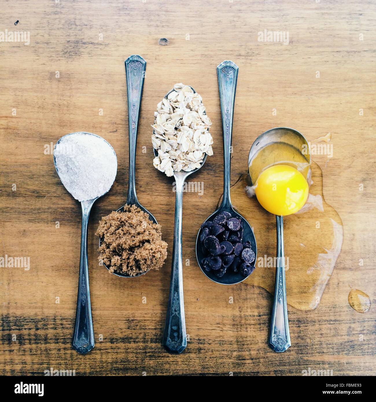 Spoons with cookie ingredients Stock Photo