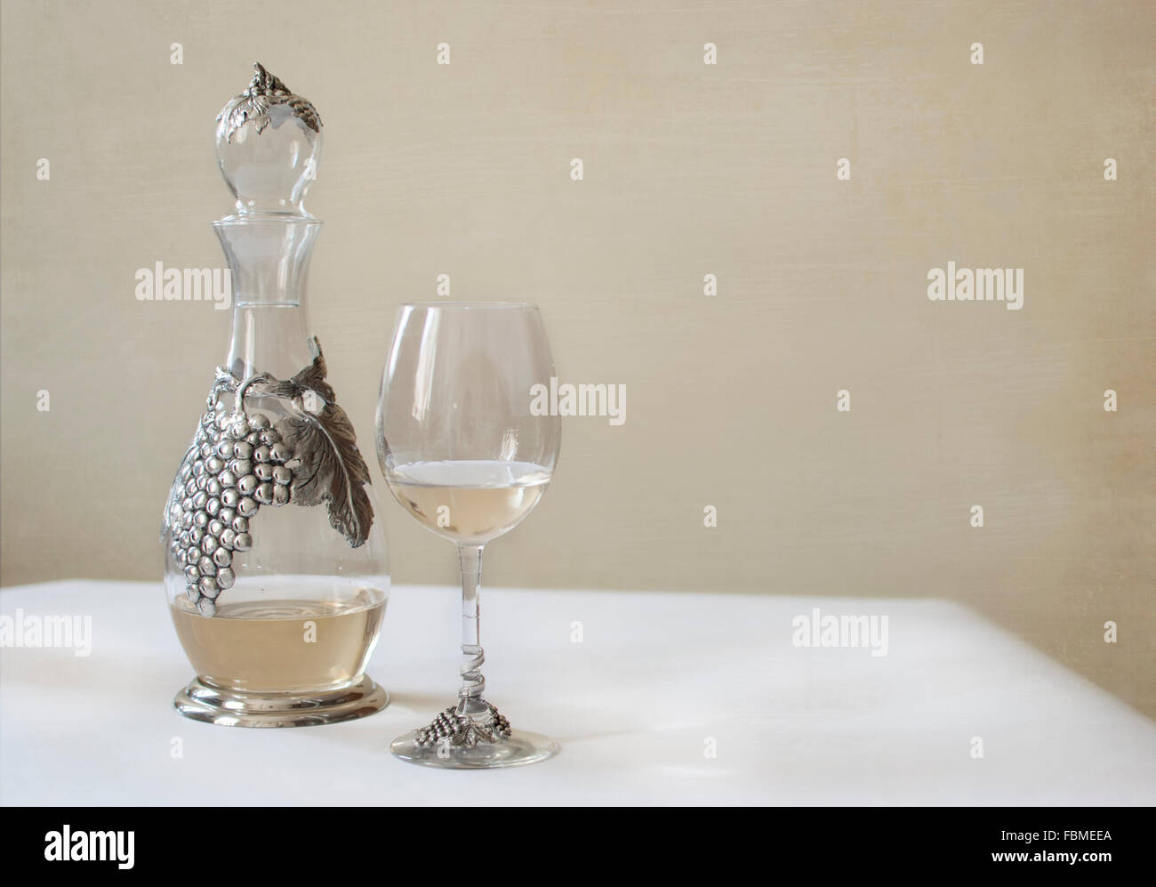 Decanter and glass of white wine Stock Photo Alamy