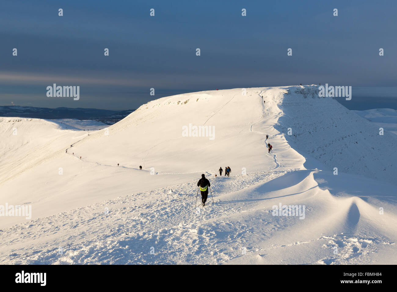 Early morning walkers scale the summits of the Brecon Beacons National Park, Wales Stock Photo