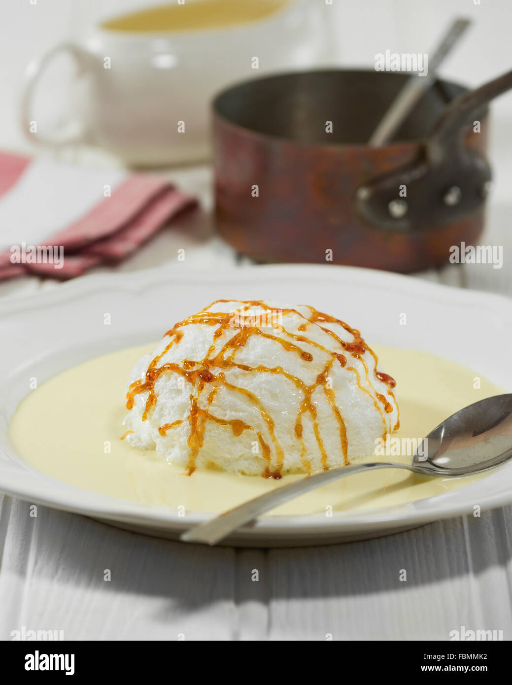 Ile flottante. Meringue and crème anglaise dessert. Stock Photo