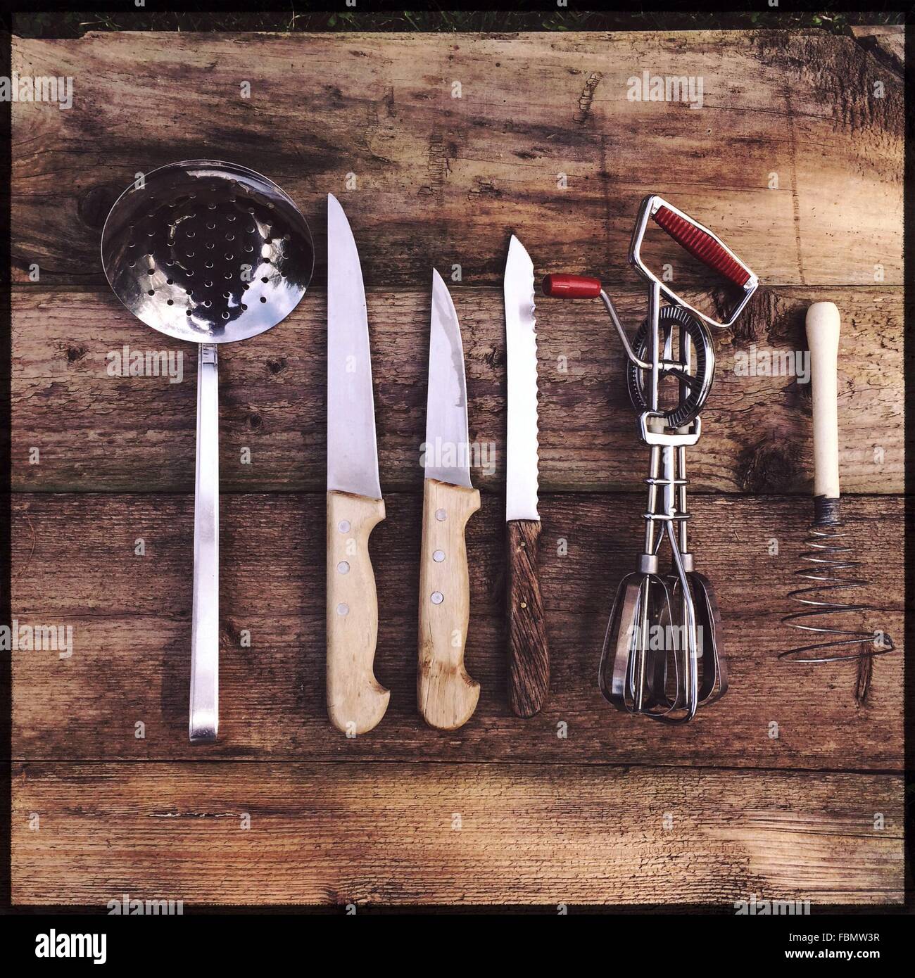 Directly Above Shot Of Kitchen Utensils On Wooden Table Stock Photo