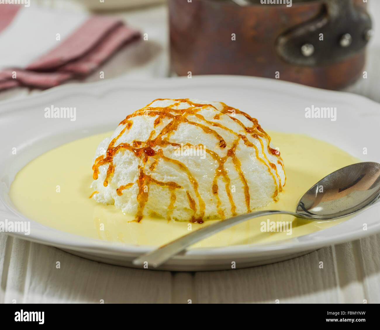 Ile flottante. Meringue and crème anglaise dessert. Stock Photo