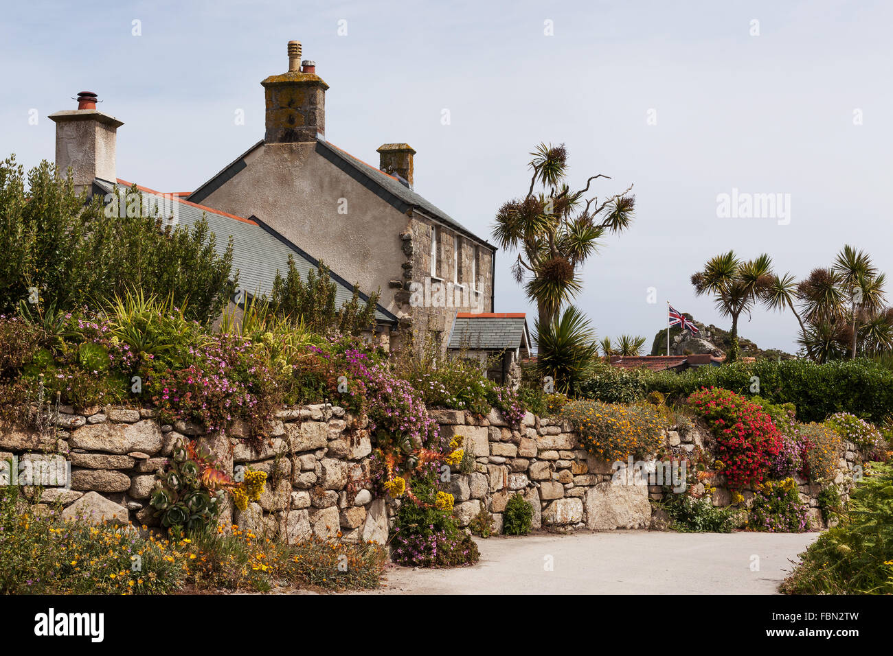 A traditional street with houses and stone wall gardens on Tresco