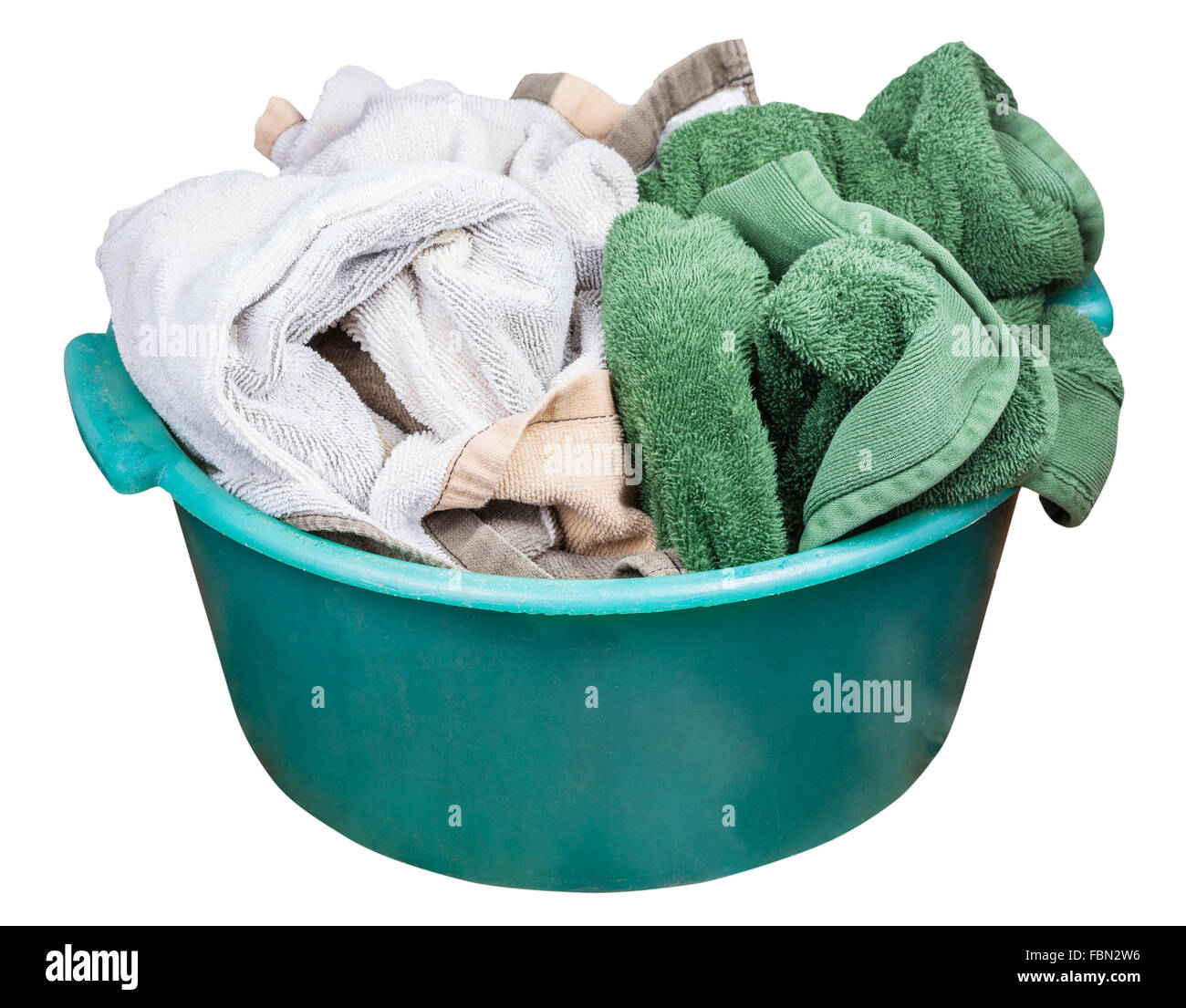 Round green plastic wash basin with dirty clothes isolated on white background Stock Photo