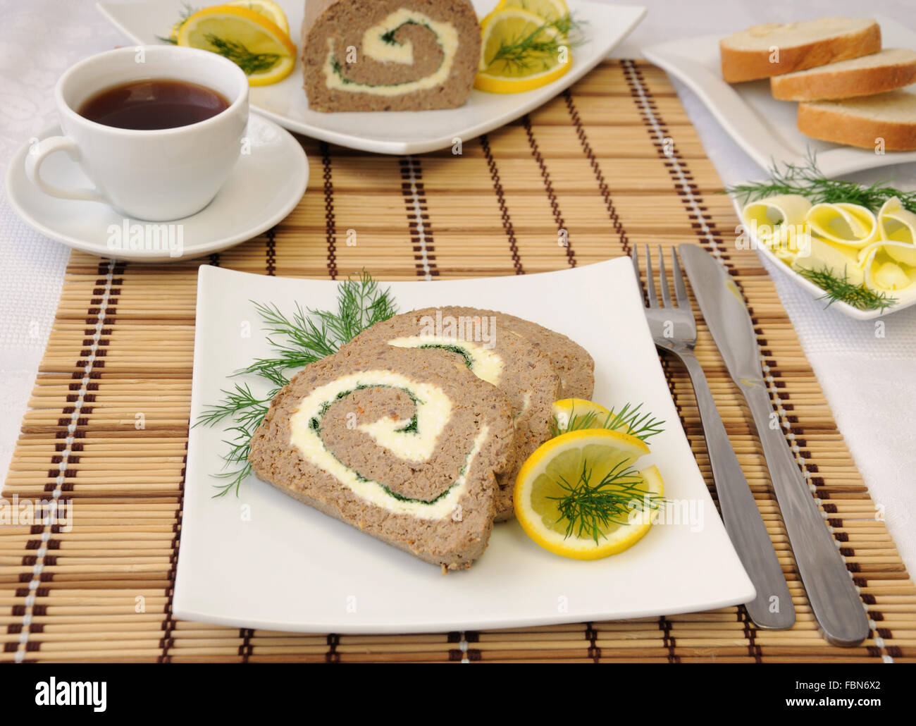 Slices of liver pate with butter and coffee for breakfast Stock Photo