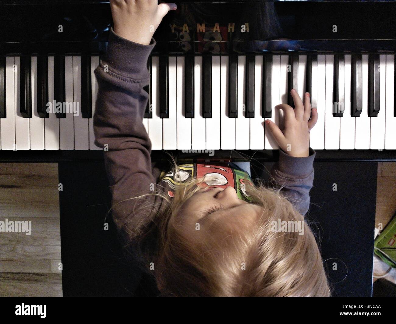 Child playing piano hi-res stock photography and images - Alamy