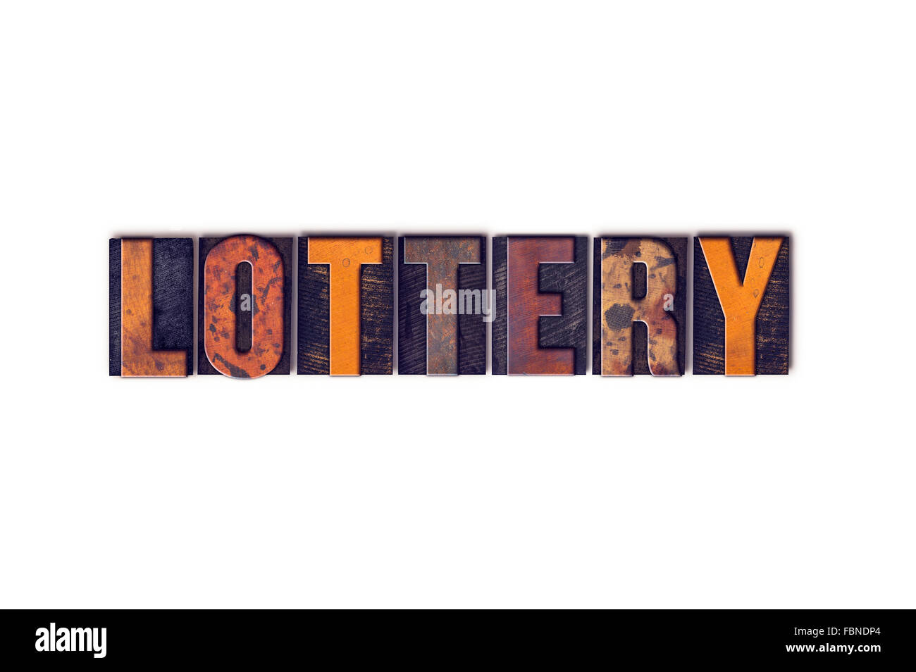 The word "Lottery" written in isolated vintage wooden letterpress type on a white background. Stock Photo