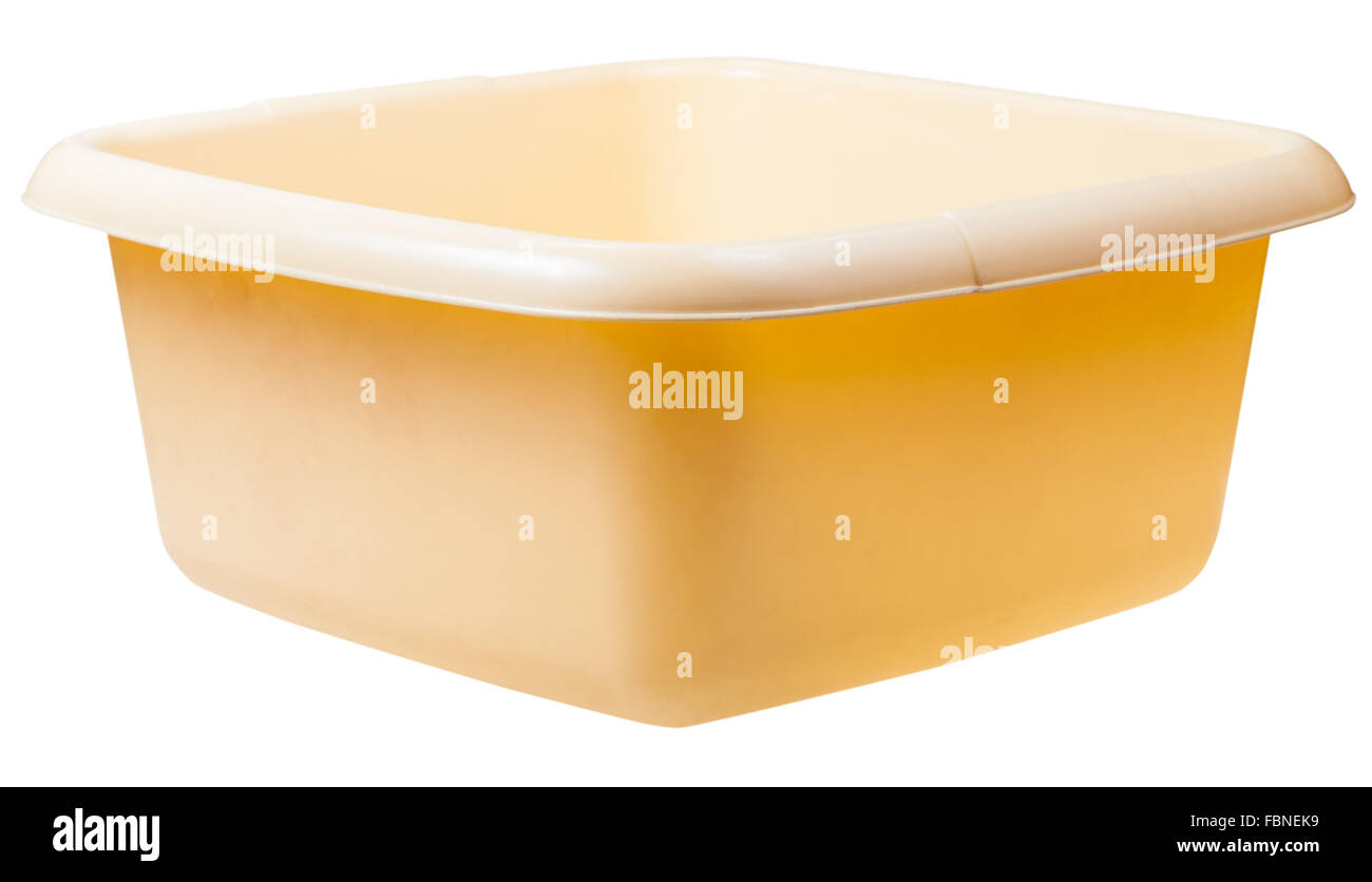 old yellow plastic rectangular wash basin isolated on white background Stock Photo
