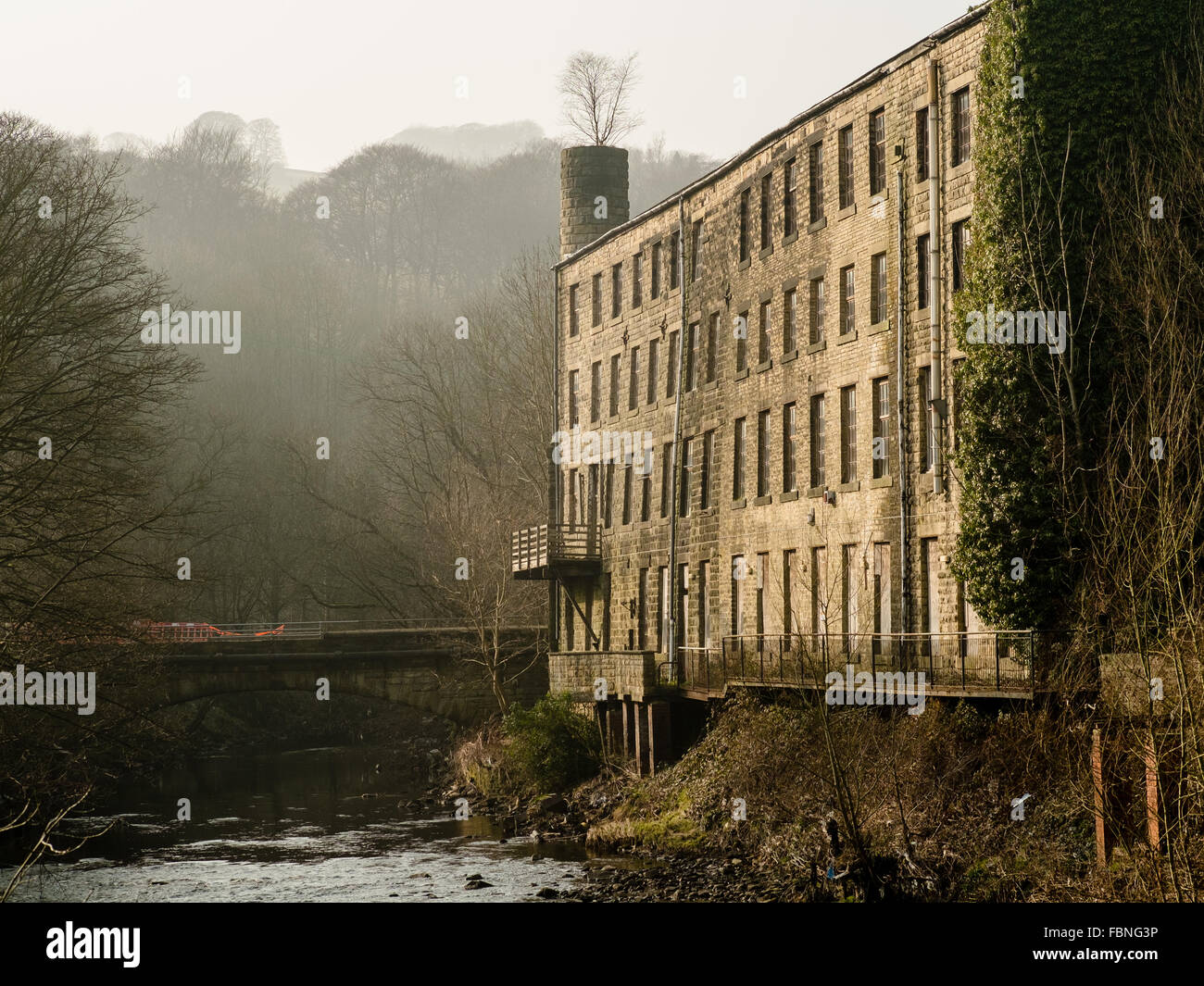 Derelict mill on the River Calder, near Hebden Bridge in West Yorkshire, England. Stock Photo