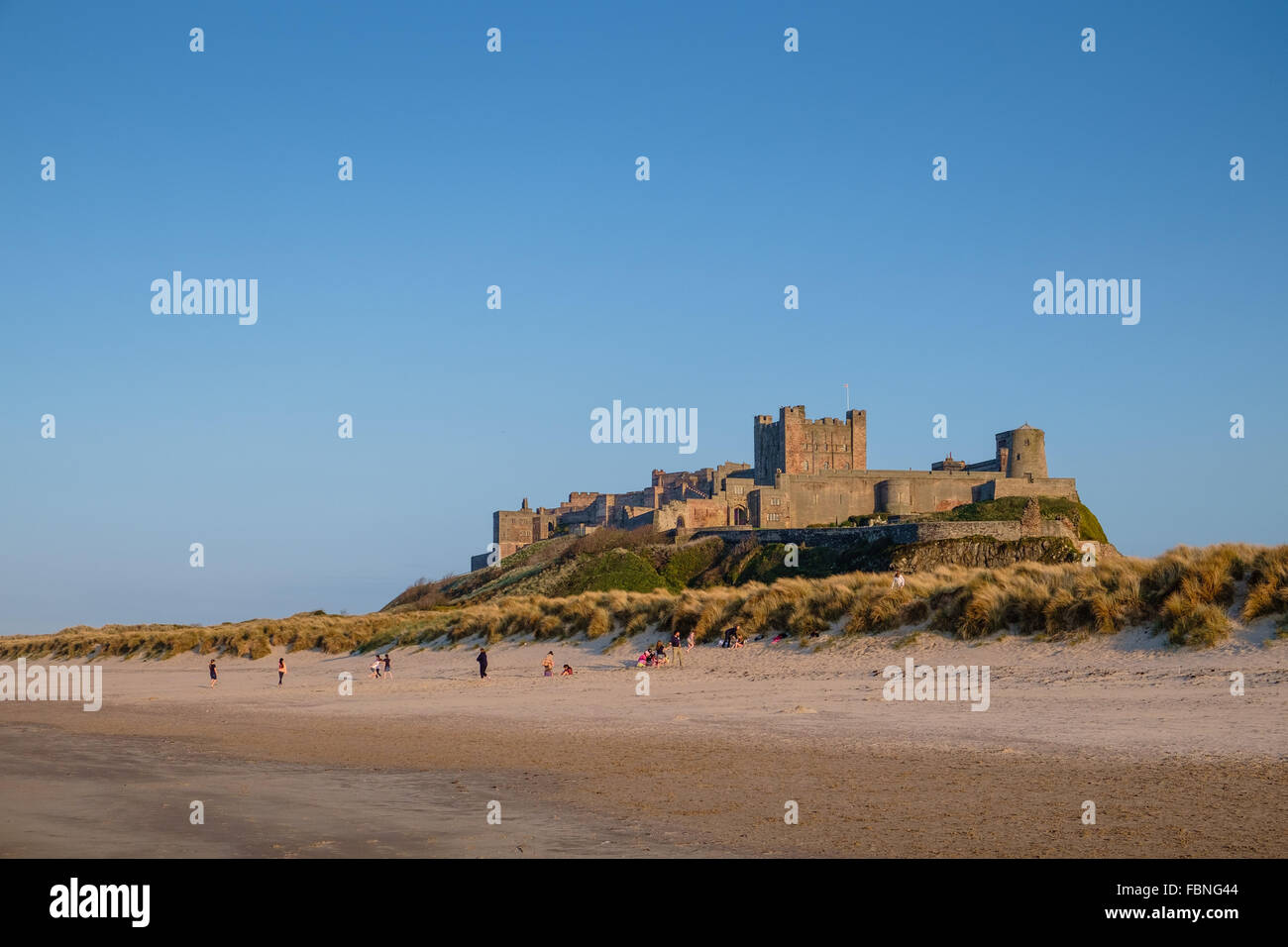 Bamburgh Castle in Northumberland, England, viewed from the beach. Stock Photo