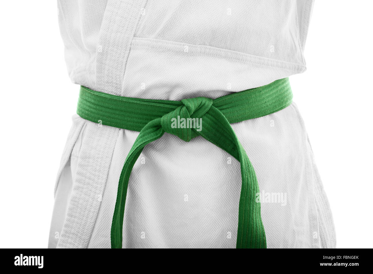 Green belt karate. Close up shot of the mid section of a martial arts  fighter in white kimono with green belt, isolated on white background Stock  Photo - Alamy