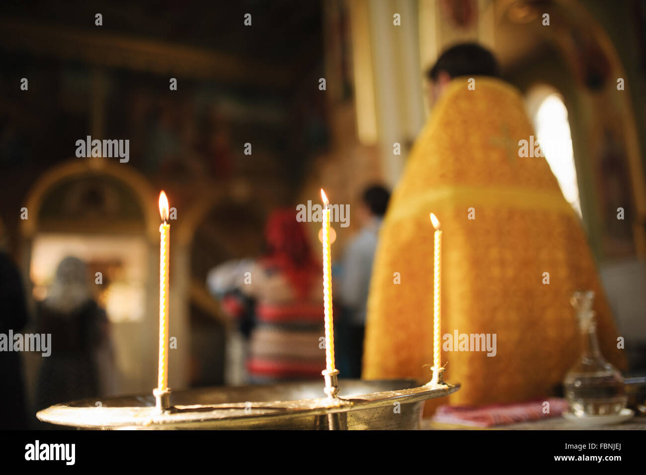 Three Candles during orthodox christening baptism Stock Photo Alamy