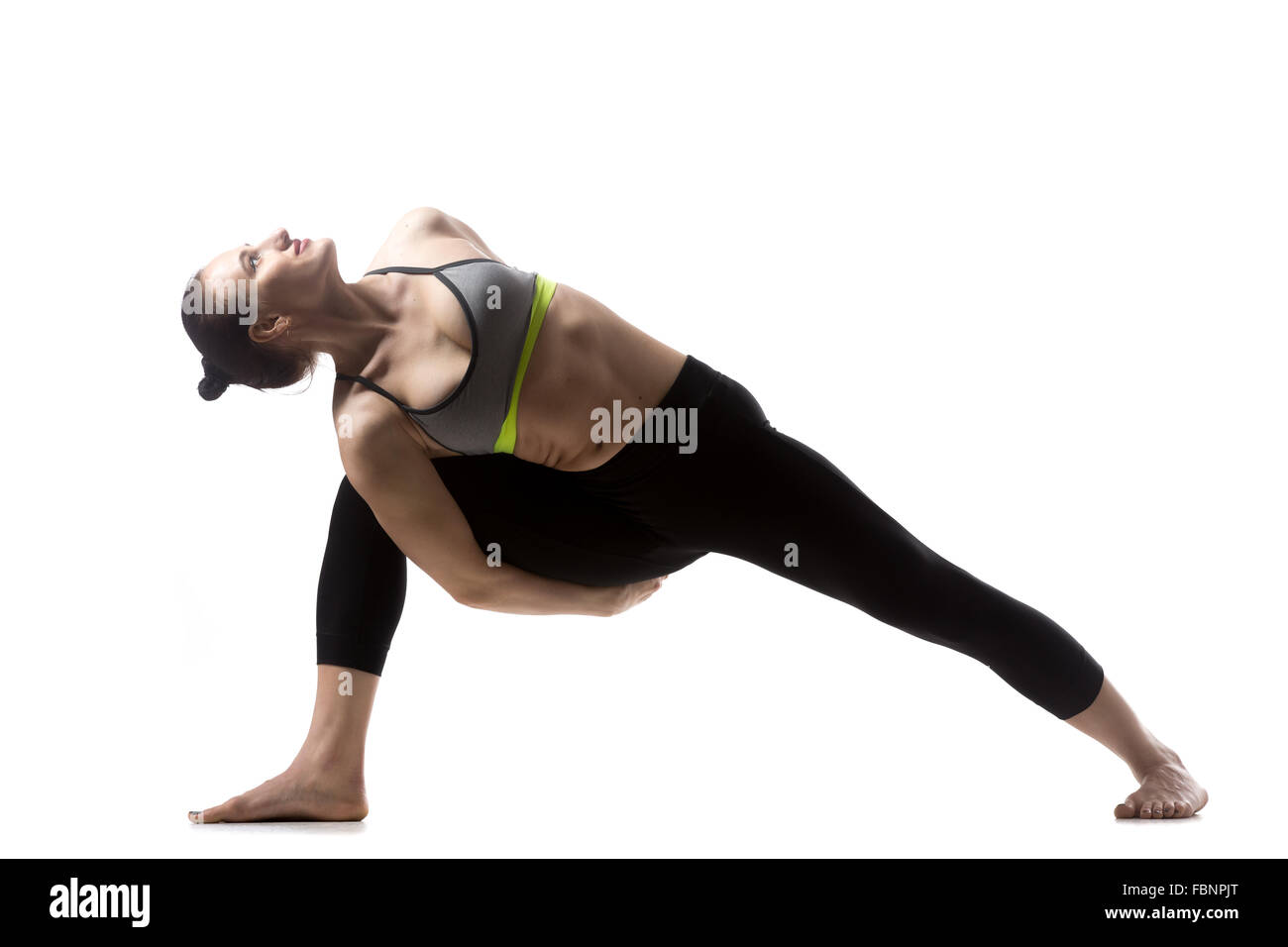 Portrait of sporty beautiful young brunette woman in sportswear bra and black pants working out, doing lunge Stock Photo