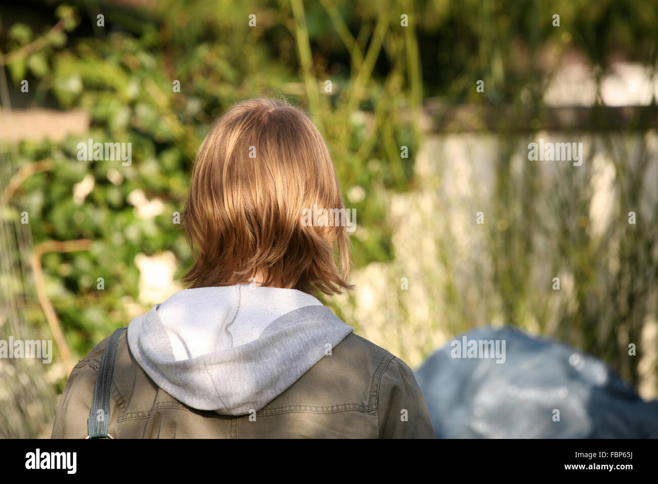 The Back Of A Teenage Girls Head With Short Brown Hair Stock Photo
