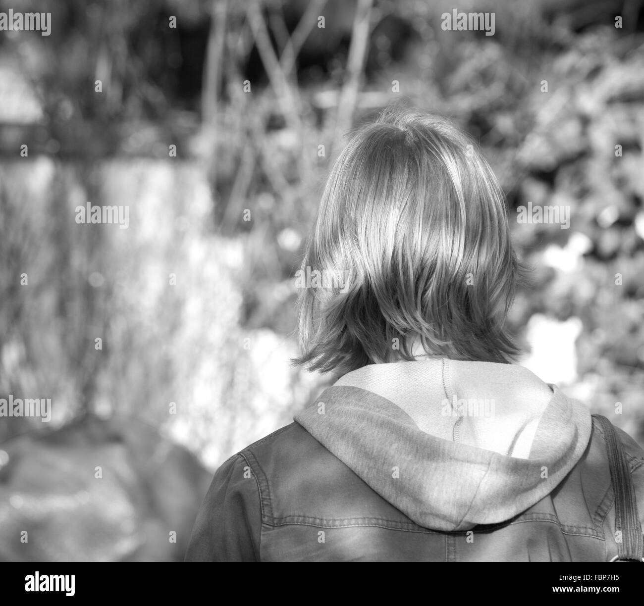 The Back Of A Teenage Girls Head With Short Brown Hair Stock Photo