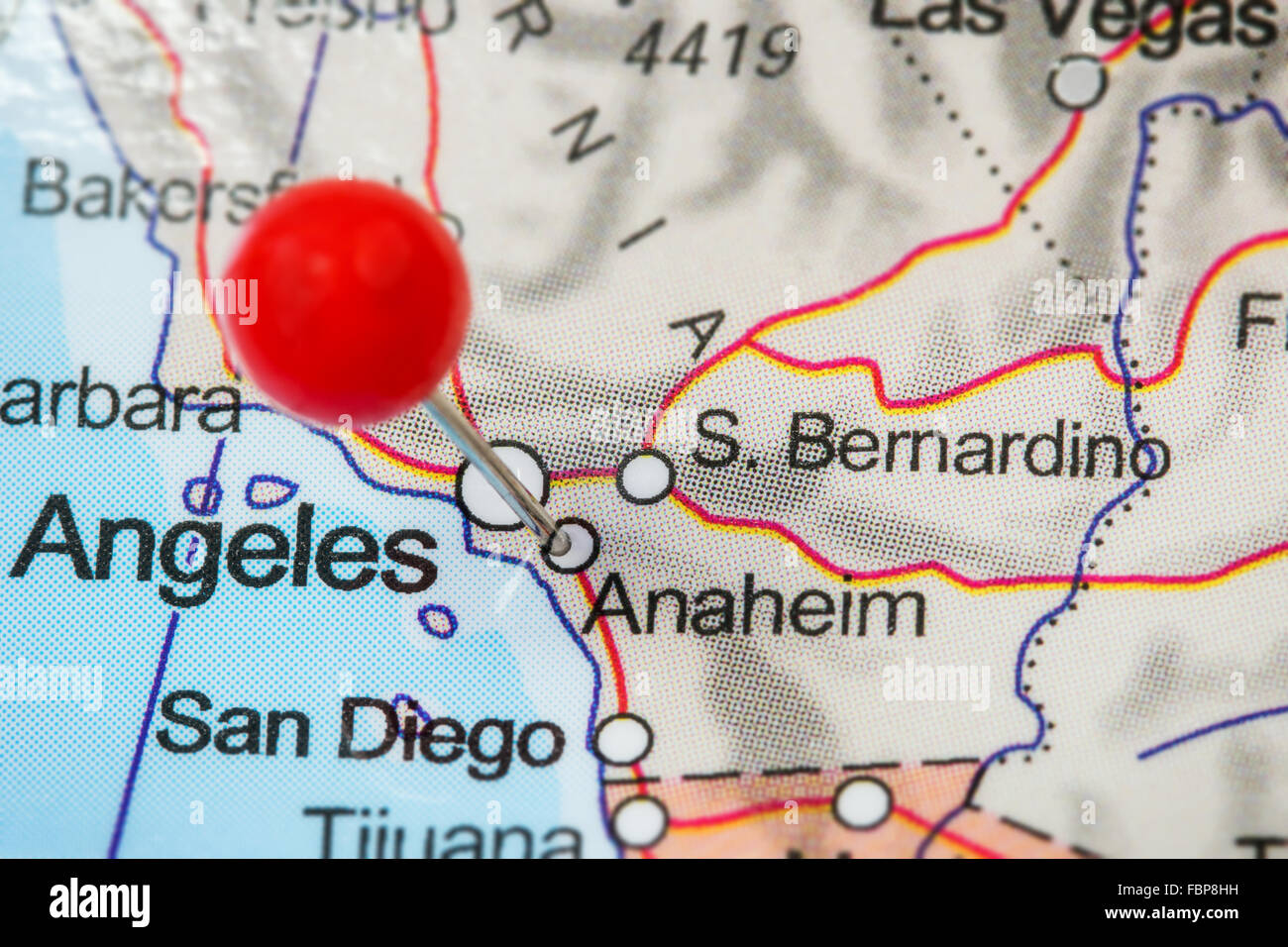 Close-up of a red pushpin in a map of Anaheim, USA. Stock Photo