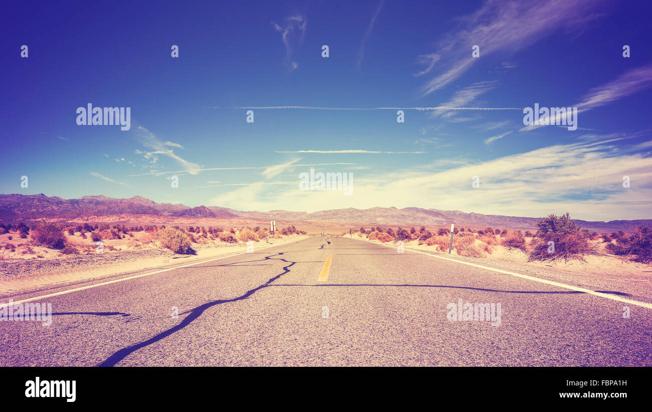 Vintage stylized endless country highway, USA. Stock Photo