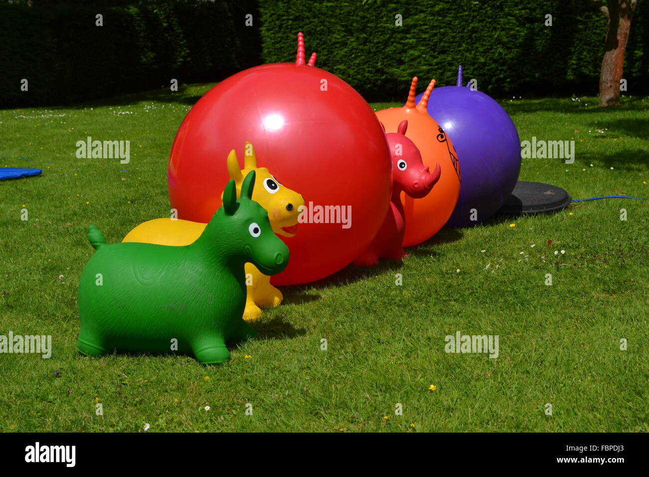 Colorful space hoppers in a line Stock Photo