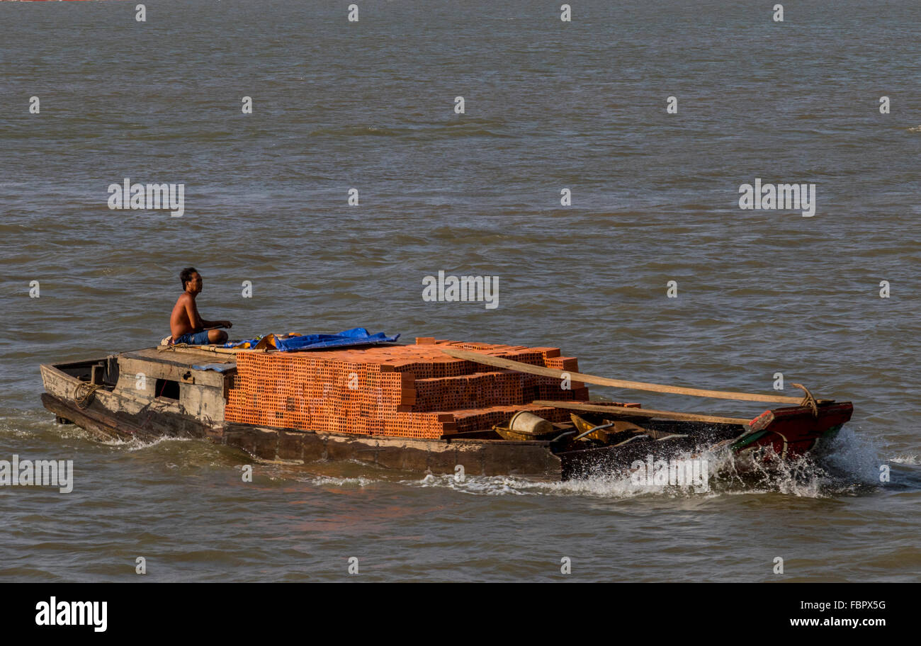 Ships on NHA Be river seen from the Binh Khanh ferry Stock Photo