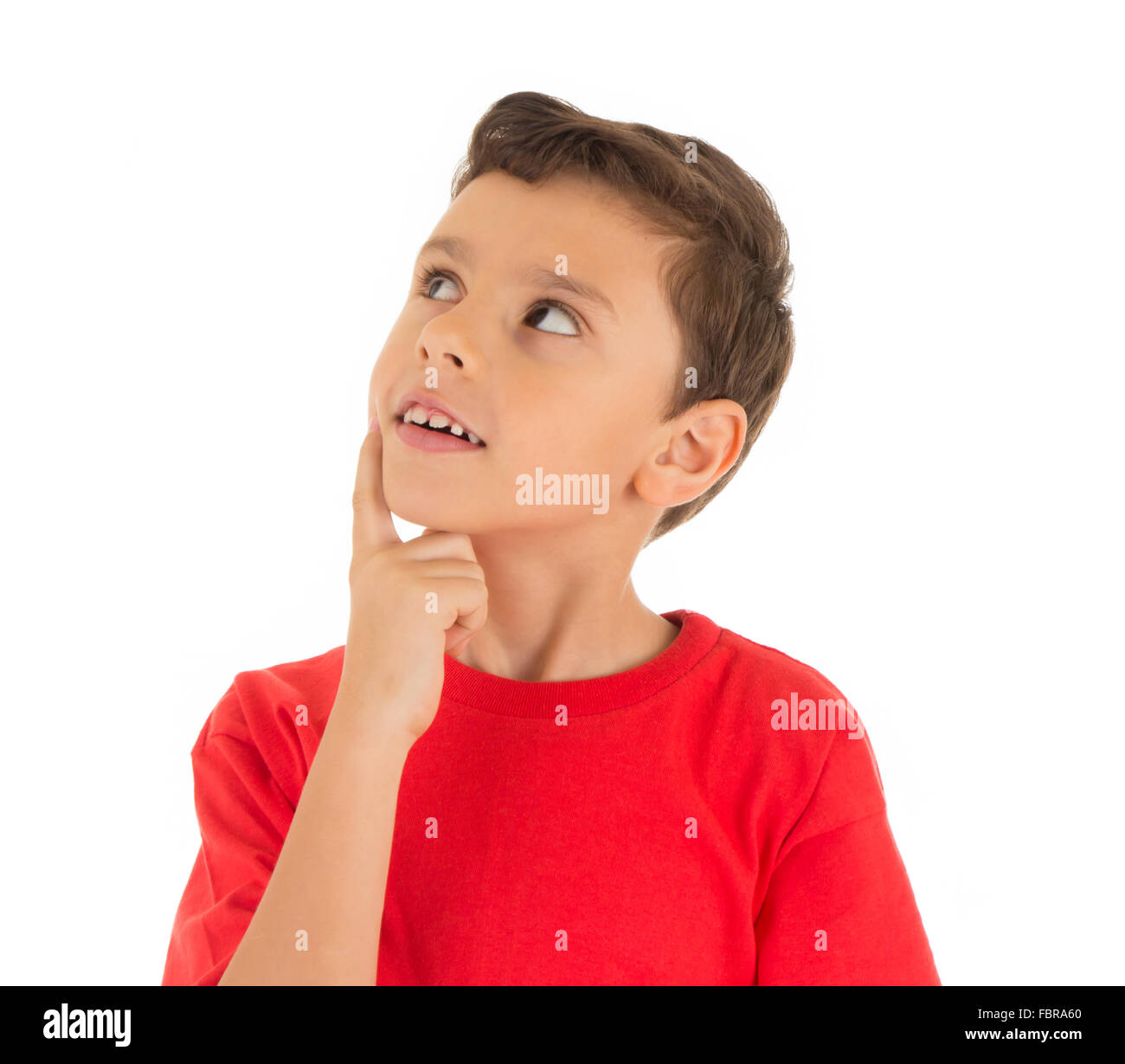 Kid looking up and thinking Stock Photo