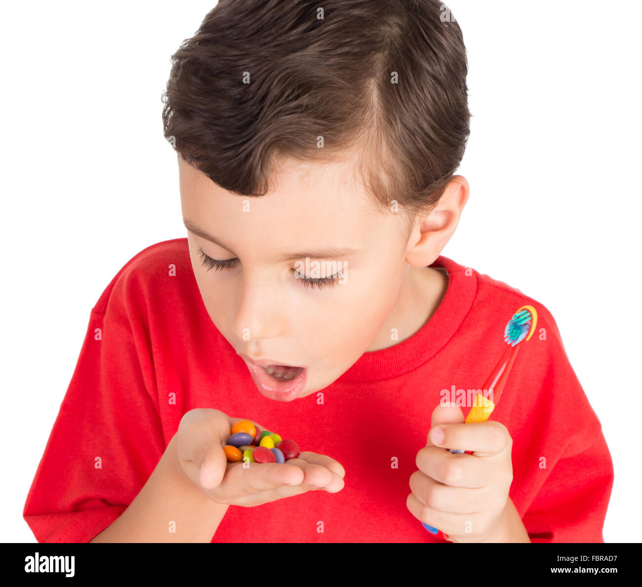 Young boy with candies and teeth brush Stock Photo Alamy