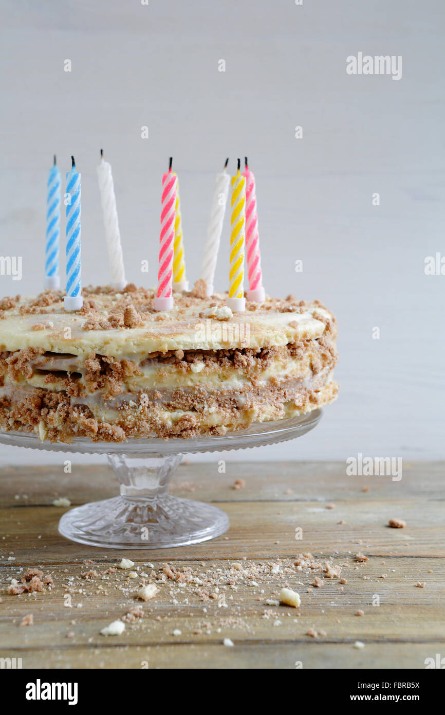 White chocolate frosted happy birthday cake candles hires stock