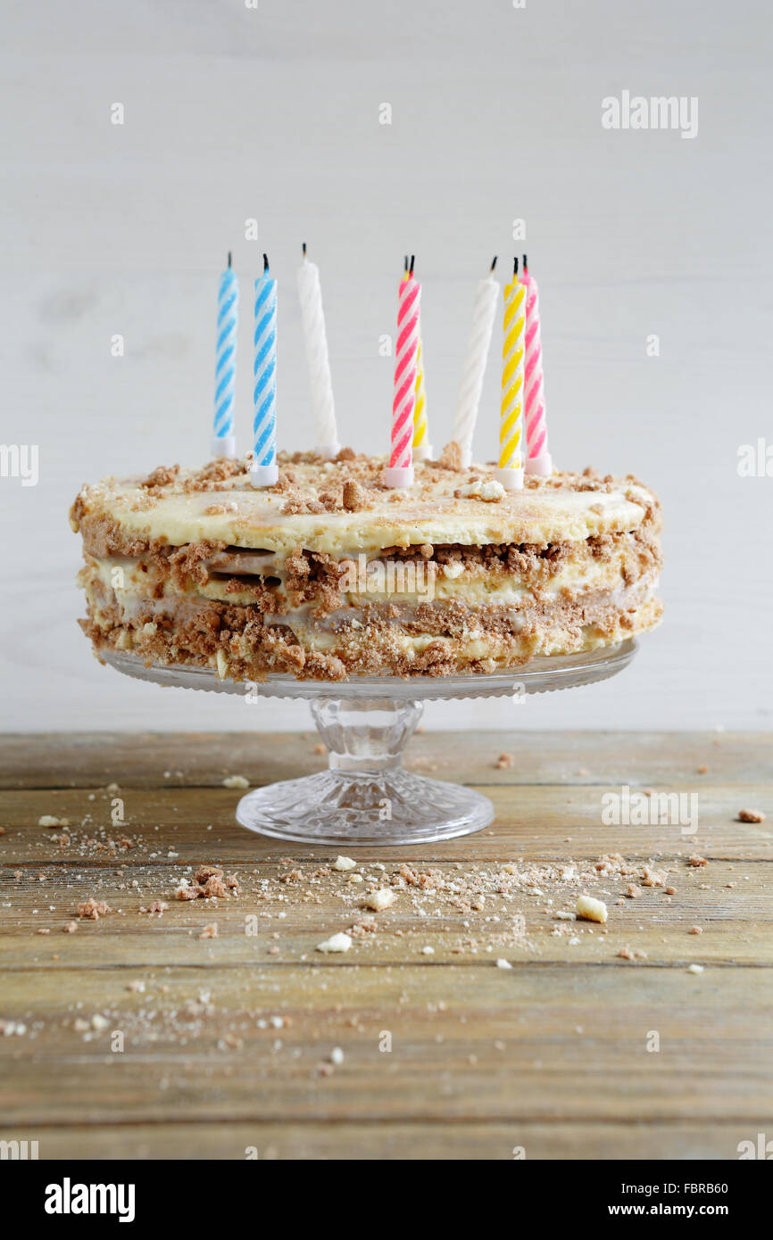 White chocolate frosted happy birthday cake candles hires stock