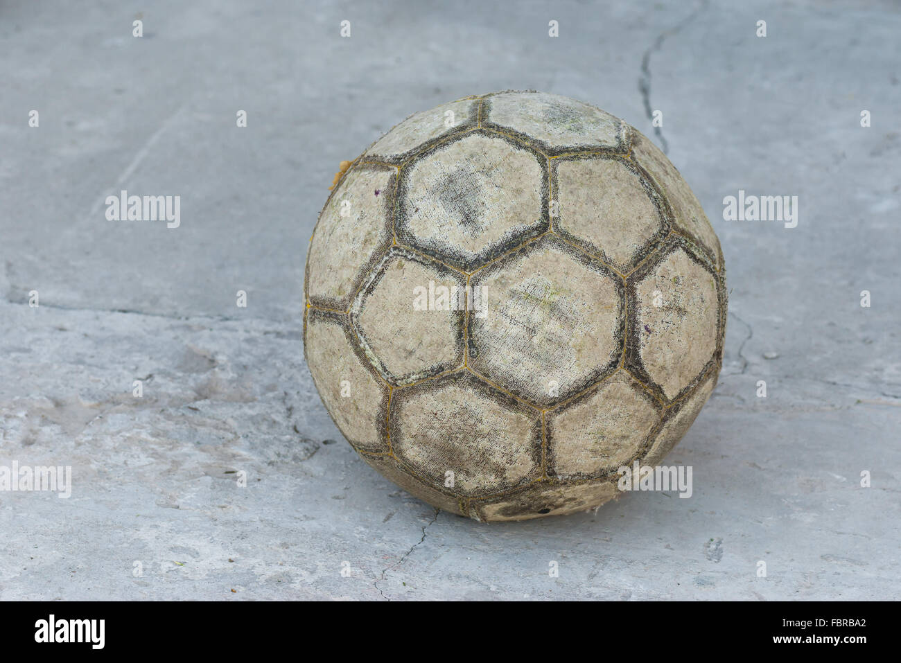 Old football (soccer ball) on a concrete surface Stock Photo Alamy