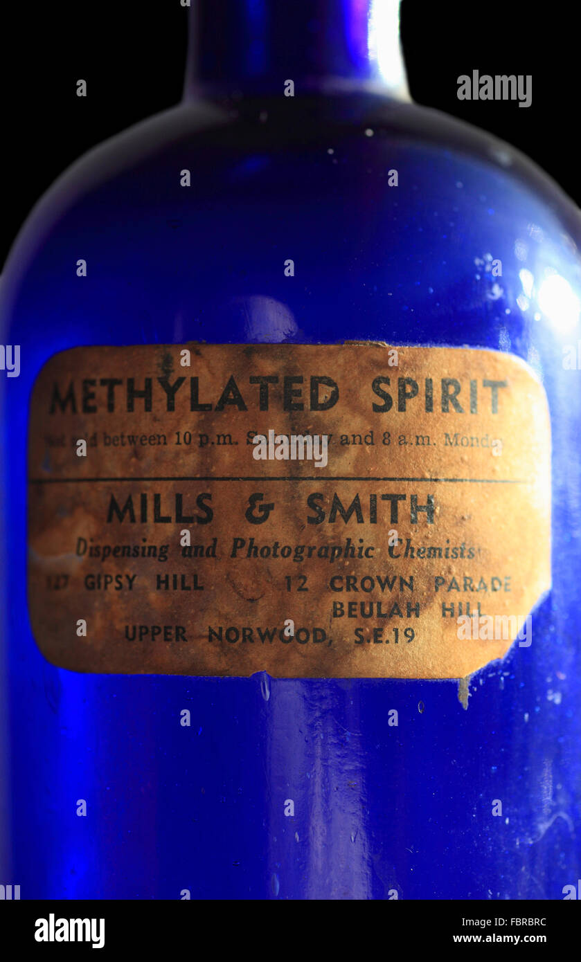 Blue glass methylated spirits bottle with label. Stock Photo