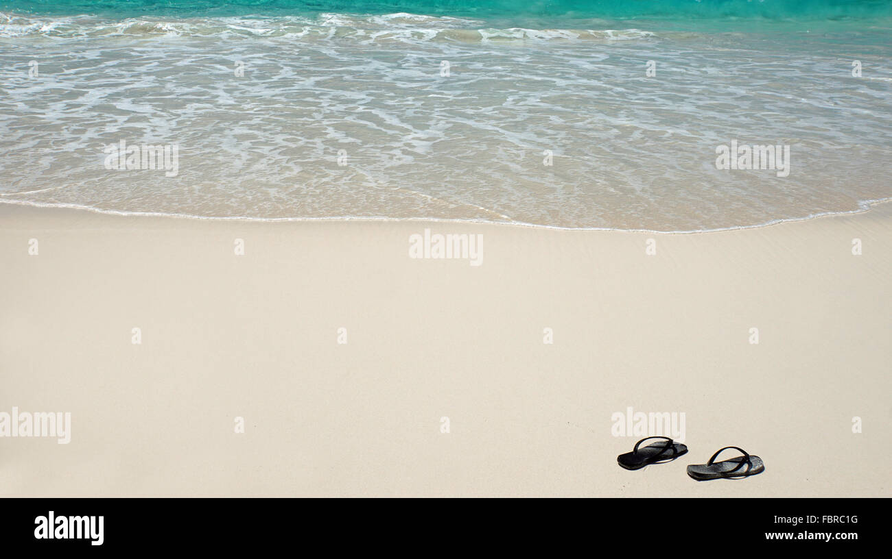 black slippers on tropical white sandy beach Stock Photo - Alamy