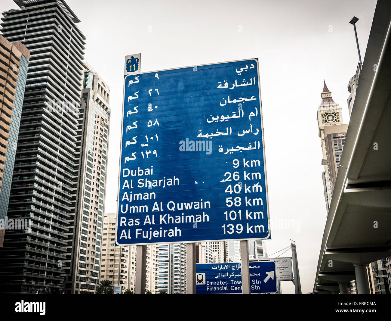 Road sign indicating distance to other emirates from Sheik Zayed Road