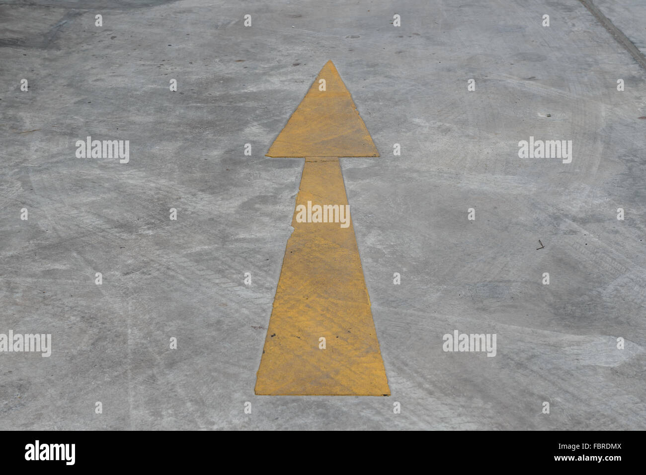 The arrow on a floor can tell you a right way for entrance or exit. Stock Photo