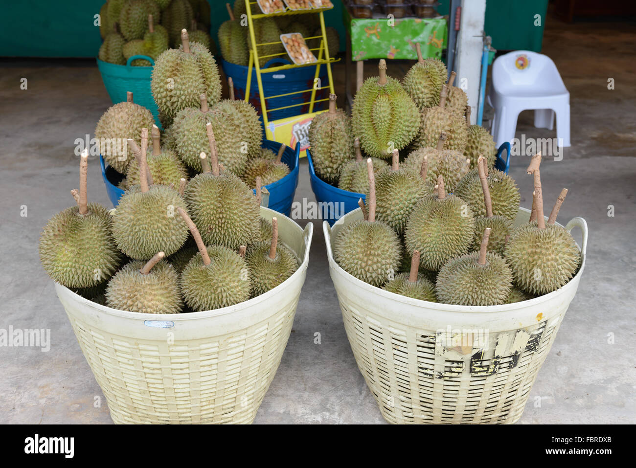 durian fruit stacked in a basket for sale in Thailand, floating market Stock Photo