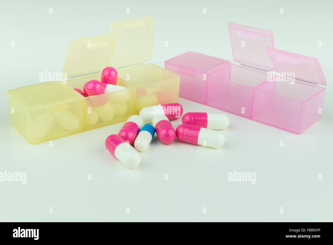 Several pills in partable compartments Stock Photo