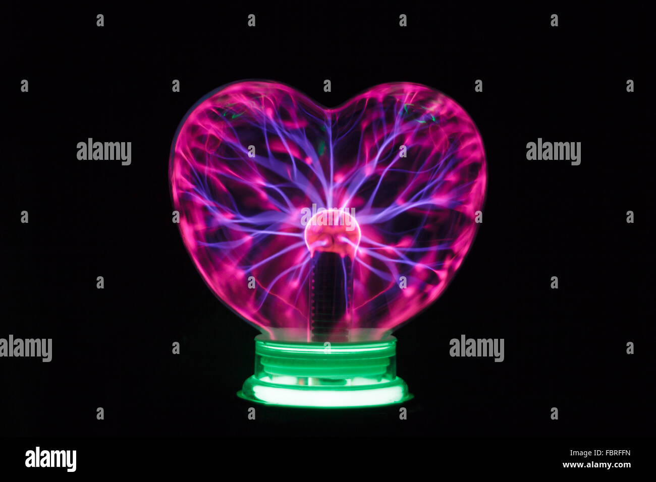 Plasma ball heart glowing in the dark Stock Photo