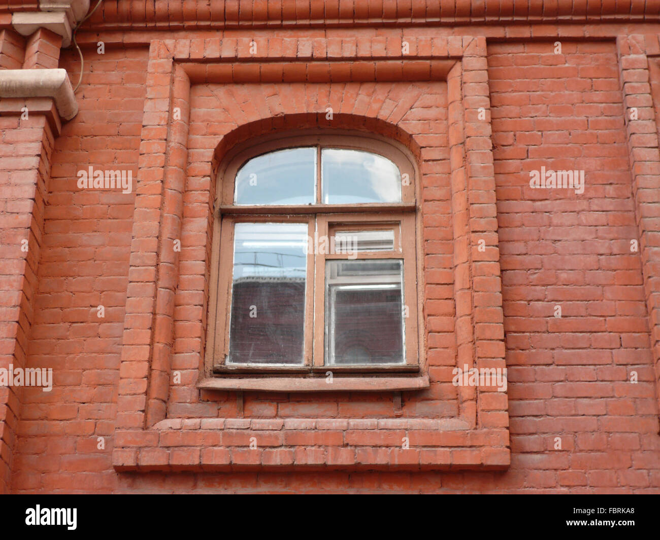 red brick wall with window at day Stock Photo - Alamy