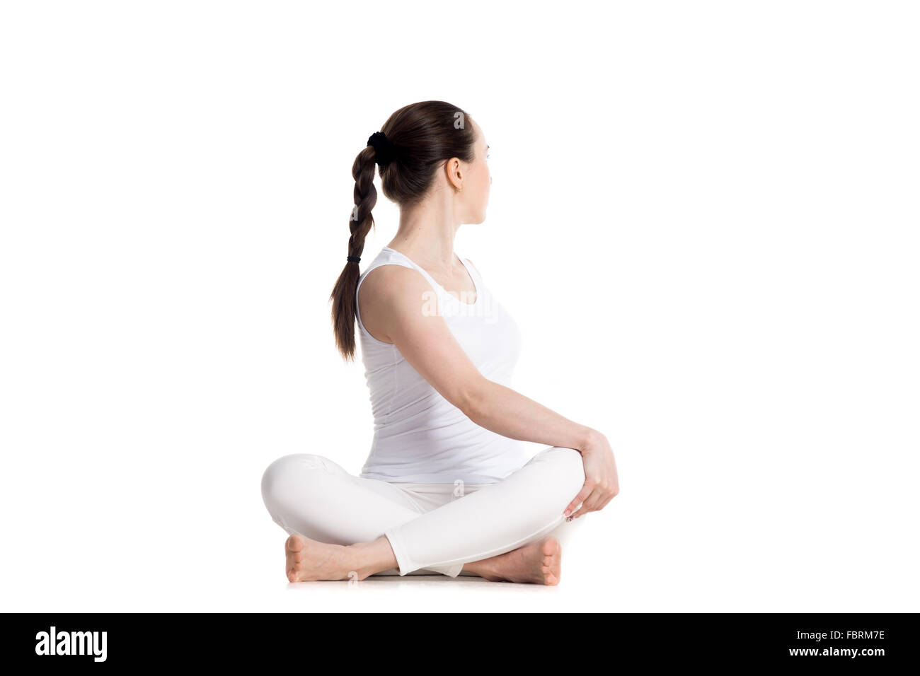 Single Caucasian Woman In Lying Yoga Pose, Legs Crossed,side View, Dressed  In Black On White Background Stock Photo, Picture and Royalty Free Image.  Image 16038627.